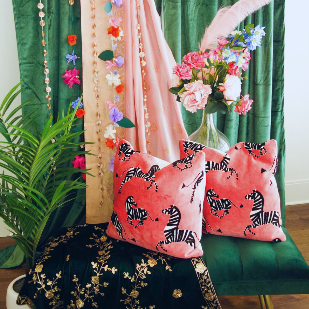 Mehndi display with hanging garlands in the backdrop including Lotus Garland