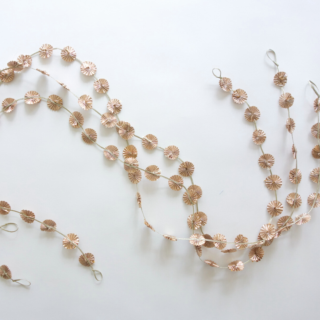 Flatlay of rose gold party garlands