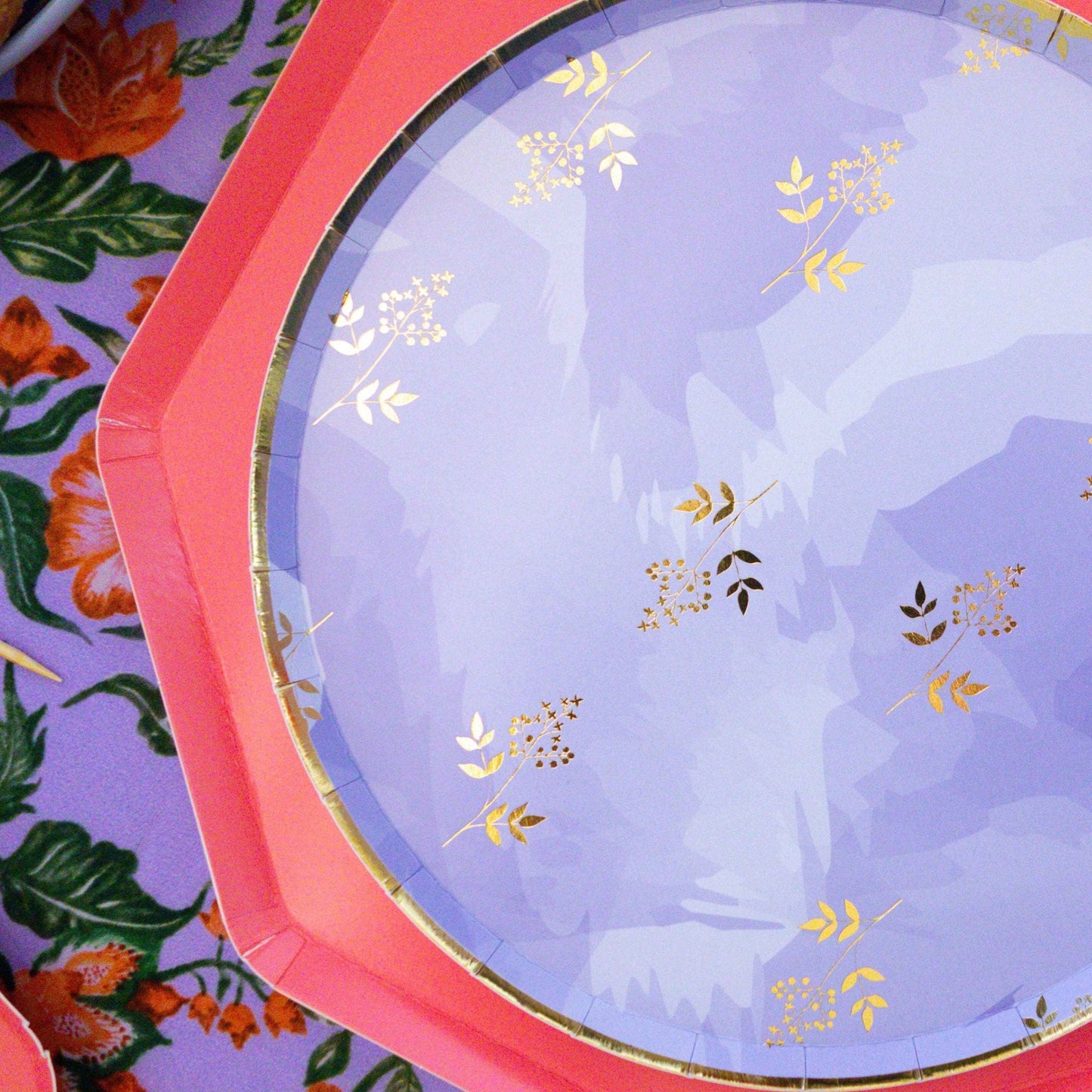 Close up of lavender and gold foil Indian party plate