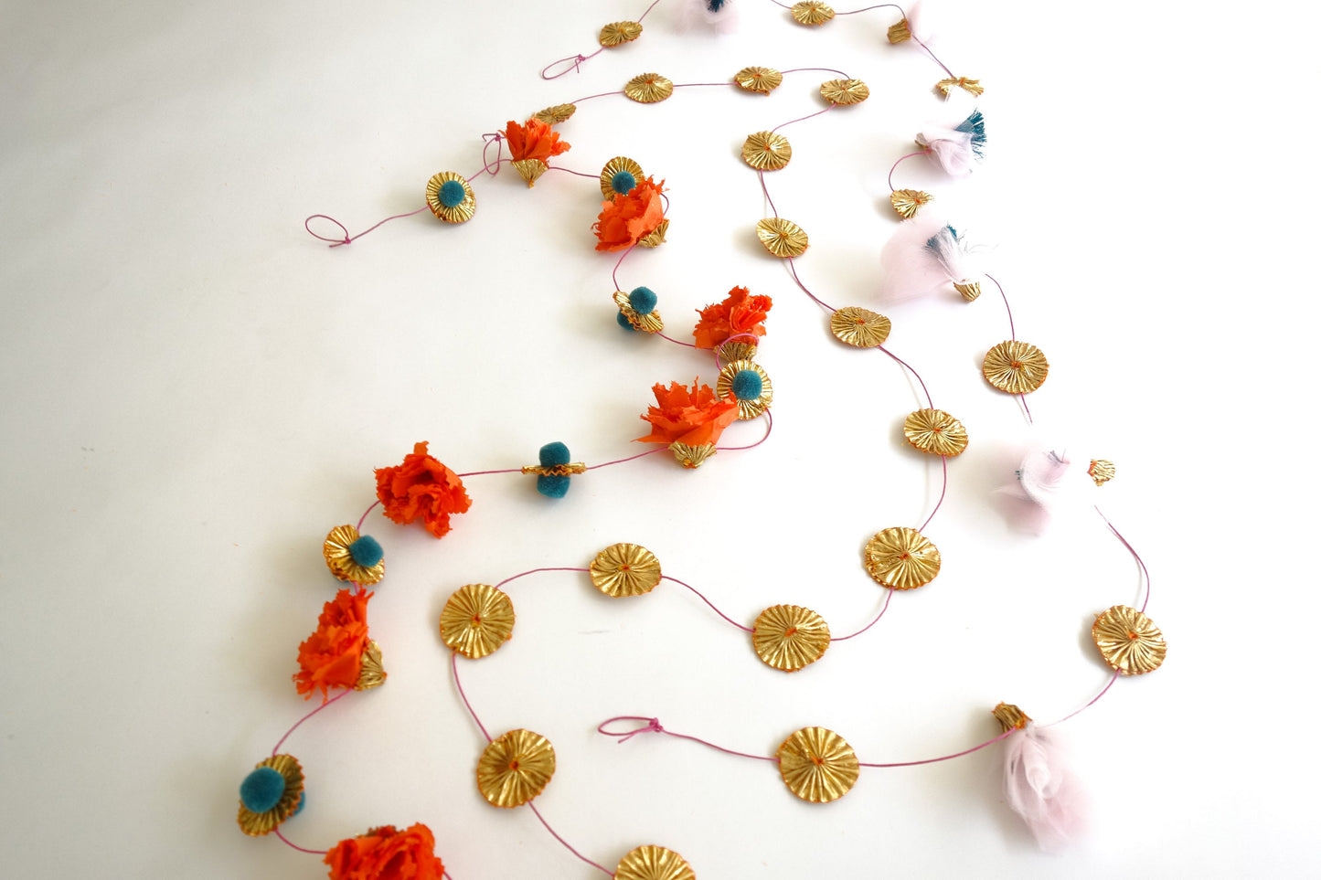 Overhead view of handmade marigold paper garland