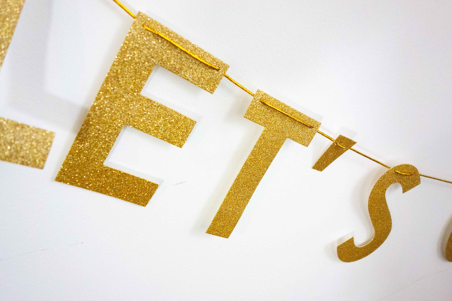 Close up of gold4.5 inch letters on Diwali banner